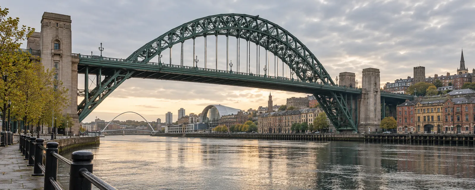 Green steel arch of the Tyne Bridge spanning the river between Newcastle and Gateshead